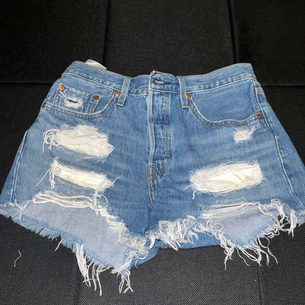 Levi’s Denim Jean Shorts, distressed. Size W27.